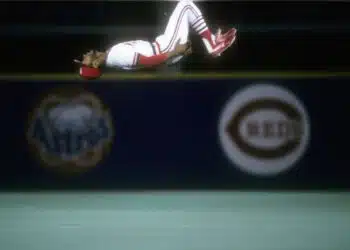 ST. LOUIS, MO - OCTOBER 1987: Shortstop Ozzie Smith #1 of the St. Louis Cardinals does a back flip at his position during the 1987 World Series against the Minnesota Twins in October 1987 at Busch Stadium in St. Louis, Missouri. The Twins won the World Series 4 games to 3.